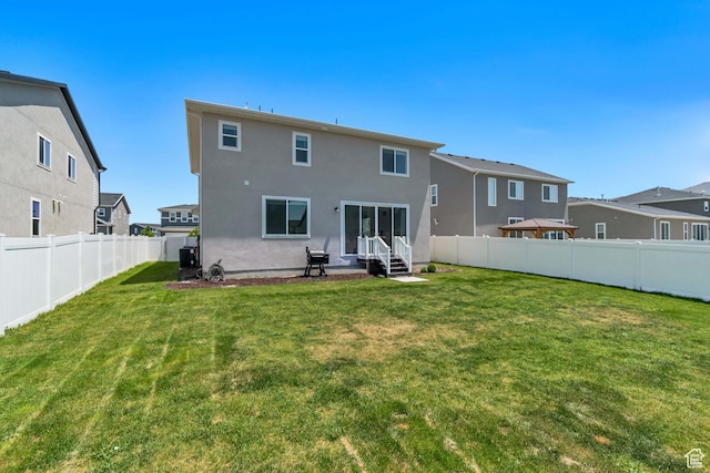 5451 N Yeager Ln, Eagle Mountain, UT 84005 - back of property with entry steps, a fenced backyard, stucco siding, and a residential view