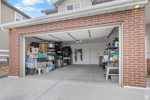 2122 W 1745th Ct S, West Haven, UT 84401 - garage featuring a garage door opener and concrete driveway