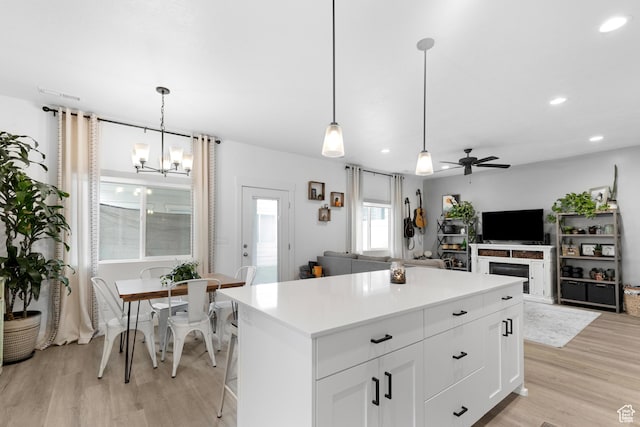 2122 W 1745th Ct S, West Haven, UT 84401 - kitchen featuring light wood finished floors, a ceiling fan, a chandelier, recessed lighting, and a kitchen island