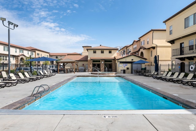 5529 W Sicily Ln N, Highland, UT 84003 - community pool featuring a gazebo, a patio area, and a residential view