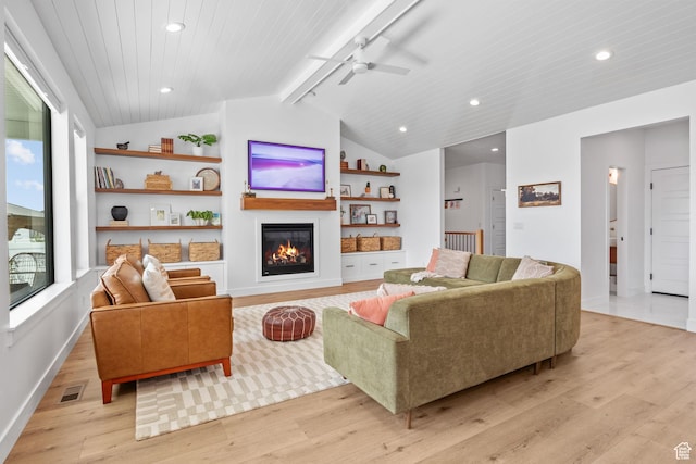 2245 W 800 S, Layton, UT 84041 - living room with light wood-style flooring, a glass covered fireplace, a ceiling fan, recessed lighting, and built in features