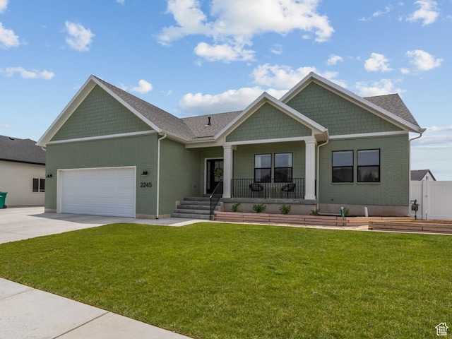 2245 W 800 S, Layton, UT 84041 - craftsman-style home featuring a porch, driveway, an attached garage, and brick siding