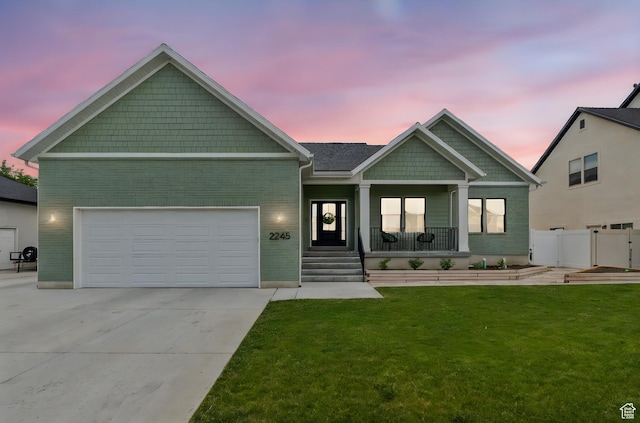 2245 W 800 S, Layton, UT 84041 - craftsman inspired home featuring a porch, brick siding, concrete driveway, and a garage