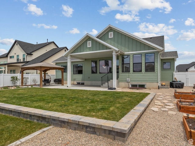 2245 W 800 S, Layton, UT 84041 - back of property with board and batten siding, a gazebo, a garden, and a patio