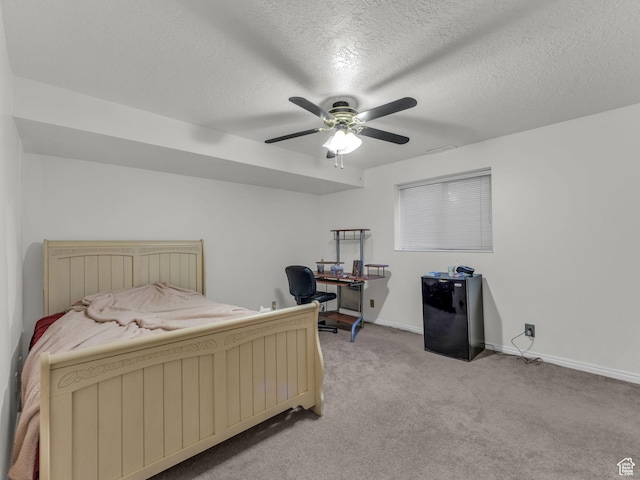 11551 S Woodhampton Dr E, Sandy, UT 84092 - bedroom featuring light carpet, a textured ceiling, fridge, a ceiling fan, and a desk
