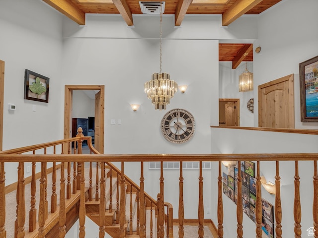 11551 S Woodhampton Dr E, Sandy, UT 84092 - hall with a wooden ceiling with exposed beams, a chandelier, and an upstairs landing