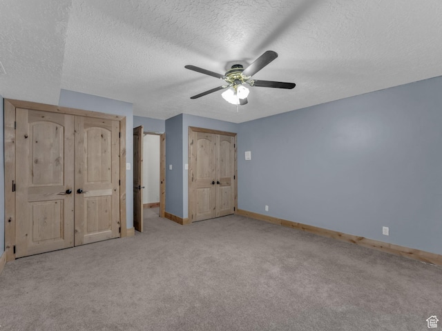 11551 S Woodhampton Dr E, Sandy, UT 84092 - unfurnished bedroom featuring carpet flooring, a textured ceiling, and a ceiling fan