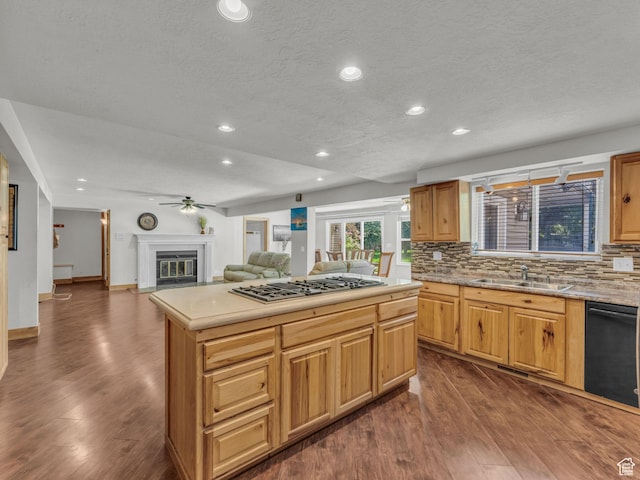 11551 S Woodhampton Dr E, Sandy, UT 84092 - kitchen with stainless steel gas cooktop, tasteful backsplash, dark wood-style floors, recessed lighting, and a textured ceiling