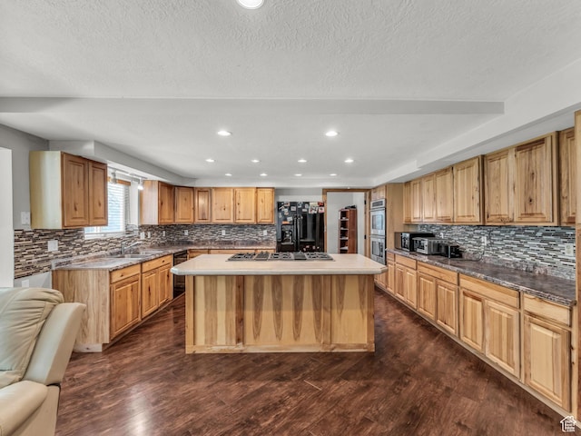 11551 S Woodhampton Dr E, Sandy, UT 84092 - kitchen featuring stainless steel appliances, tasteful backsplash, a kitchen island, dark wood-style flooring, and recessed lighting