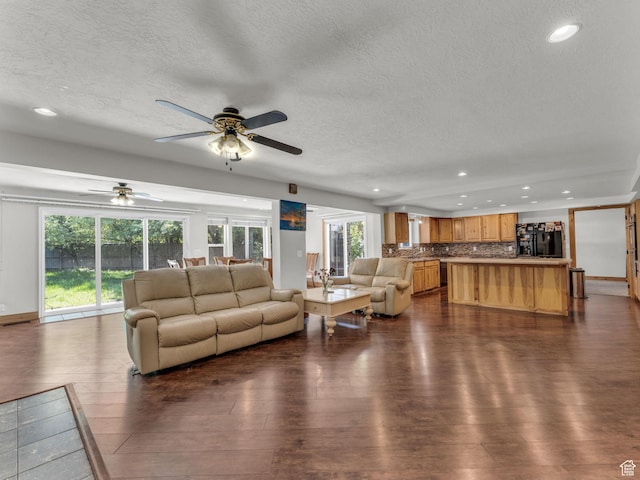 11551 S Woodhampton Dr E, Sandy, UT 84092 - living room featuring a textured ceiling, recessed lighting, a ceiling fan, and dark wood-style flooring