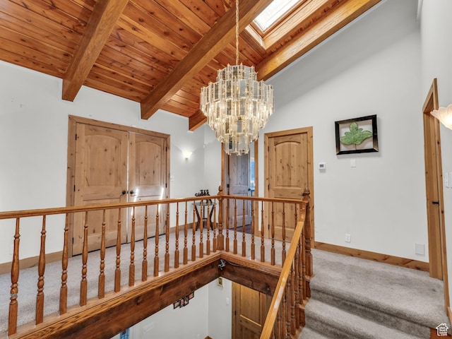 11551 S Woodhampton Dr E, Sandy, UT 84092 - stairway featuring wooden ceiling, carpet, and a chandelier