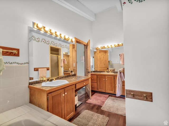 11551 S Woodhampton Dr E, Sandy, UT 84092 - full bathroom with a stall shower, two vanities, a high ceiling, and wood finished floors