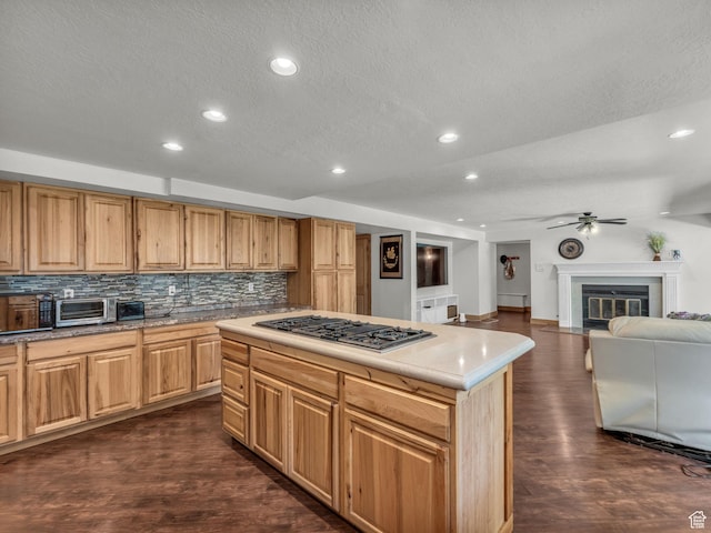 11551 S Woodhampton Dr E, Sandy, UT 84092 - kitchen featuring stainless steel gas cooktop, tasteful backsplash, recessed lighting, dark wood-style floors, and ceiling fan