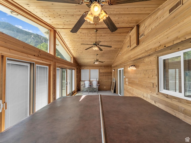 11551 S Woodhampton Dr E, Sandy, UT 84092 - unfurnished sunroom with wooden walls, lofted ceiling, ceiling fan, plenty of natural light, and wooden ceiling