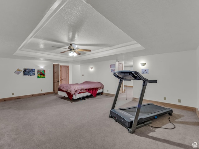 11551 S Woodhampton Dr E, Sandy, UT 84092 - carpeted bedroom featuring a tray ceiling, a textured ceiling, and a ceiling fan