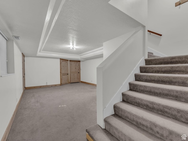 11551 S Woodhampton Dr E, Sandy, UT 84092 - finished basement featuring stairway, light carpet, and a textured ceiling