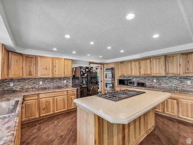 11551 S Woodhampton Dr E, Sandy, UT 84092 - kitchen with stainless steel appliances, dark wood-style floors, tasteful backsplash, recessed lighting, and a kitchen island
