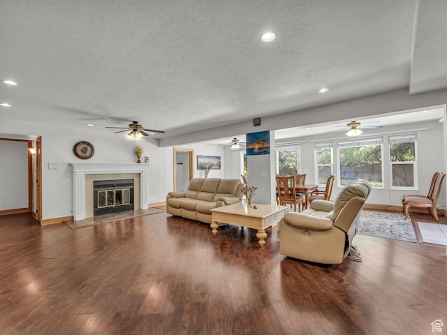 11551 S Woodhampton Dr E, Sandy, UT 84092 - living area with a textured ceiling, a ceiling fan, a tile fireplace, wood finished floors, and recessed lighting