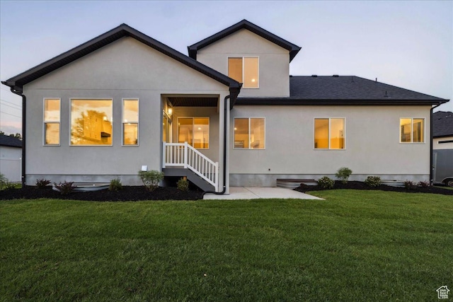 954 S Sandy Ln, Spanish Fork, UT 84660 - back of property with a lawn, stucco siding, and a patio area