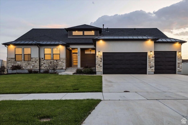 954 S Sandy Ln, Spanish Fork, UT 84660 - view of front of house featuring a standing seam roof, stone siding, a garage, and a front lawn