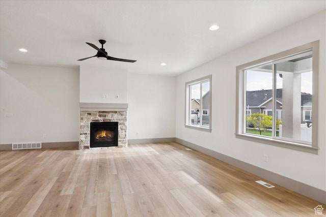 954 S Sandy Ln, Spanish Fork, UT 84660 - unfurnished living room featuring light wood finished floors, a stone fireplace, recessed lighting, and ceiling fan