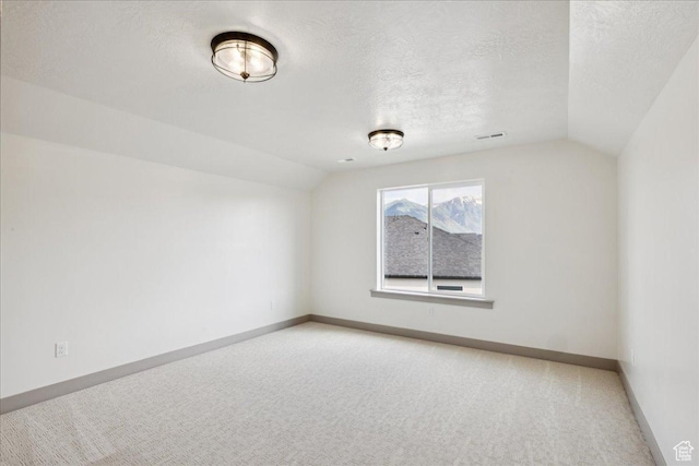 954 S Sandy Ln, Spanish Fork, UT 84660 - empty room with lofted ceiling, light carpet, and a textured ceiling