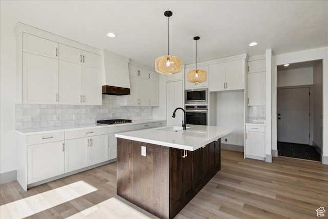 954 S Sandy Ln, Spanish Fork, UT 84660 - kitchen featuring appliances with stainless steel finishes, light wood finished floors, white cabinets, and recessed lighting