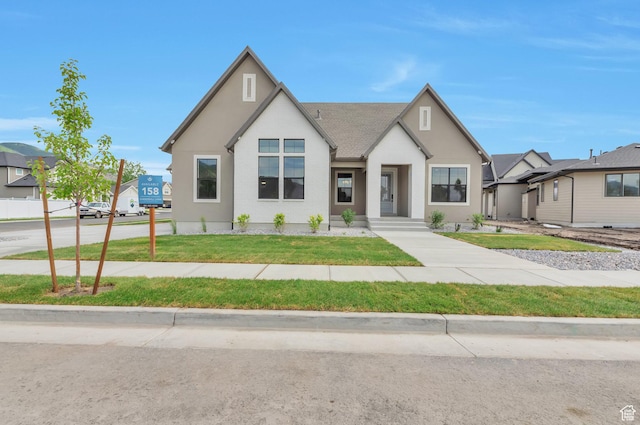 551 W Summerhill Ln, Centerville, UT 84014 - view of front of home featuring a front yard and stucco siding