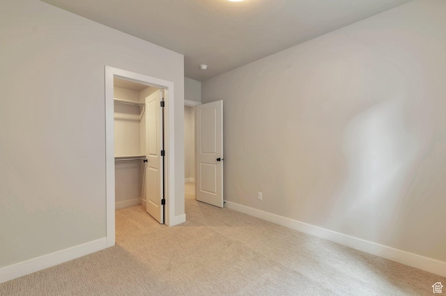 551 W Summerhill Ln, Centerville, UT 84014 - unfurnished bedroom featuring light colored carpet, a walk in closet, and a closet