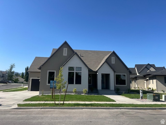 551 W Summerhill Ln, Centerville, UT 84014 - view of front facade featuring concrete driveway, an attached garage, a front lawn, and roof with shingles