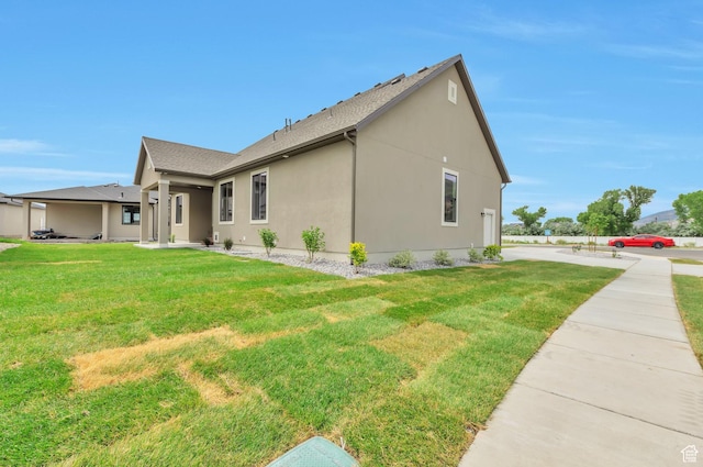 551 W Summerhill Ln, Centerville, UT 84014 - view of property exterior with a yard and stucco siding