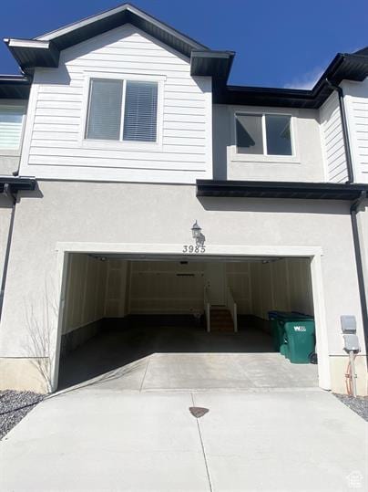 3985 W 1960 N, Lehi, UT 84043 - view of side of home featuring a garage, stucco siding, and driveway