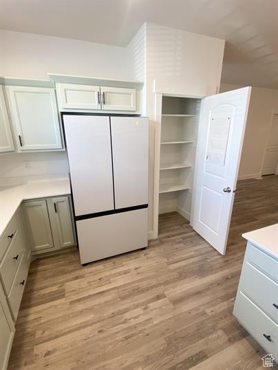 3985 W 1960 N, Lehi, UT 84043 - kitchen featuring freestanding refrigerator, light wood-style flooring, and light countertops