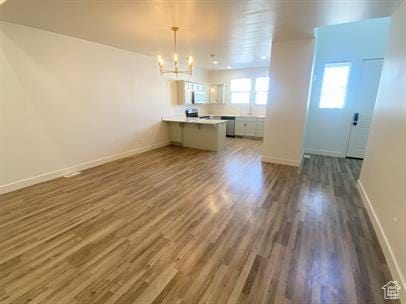 3985 W 1960 N, Lehi, UT 84043 - unfurnished dining area with a chandelier and dark wood-style flooring