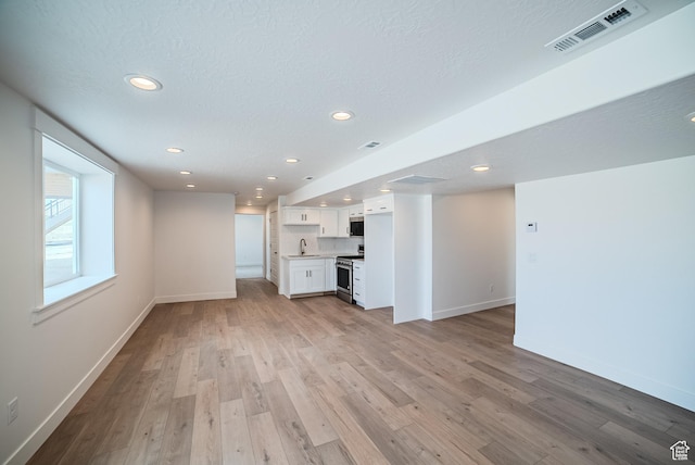 1272 S Boxelder Dr, Saratoga Springs, UT 84005 - unfurnished living room featuring recessed lighting and light wood finished floors