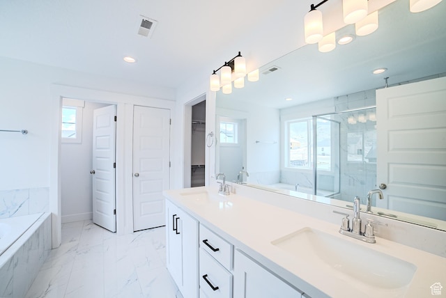 1272 S Boxelder Dr, Saratoga Springs, UT 84005 - bathroom with recessed lighting, a marble finish shower, a garden tub, marble look tile flooring, and double vanity