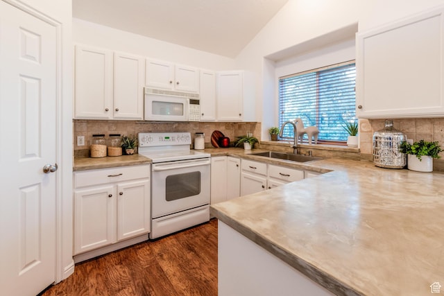 1282 W 1200 S, Woods Cross, UT 84087 - kitchen featuring white appliances, lofted ceiling, white cabinetry, and decorative backsplash