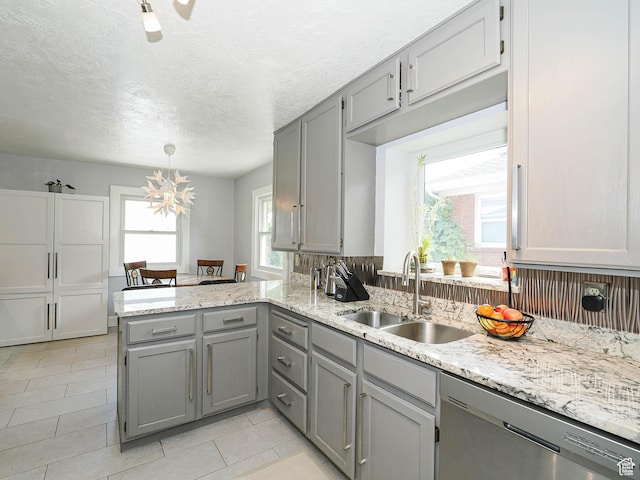 1527 E Princeton Ave S, Salt Lake City, UT 84105 - kitchen with dishwasher, gray cabinetry, a peninsula, light tile patterned floors, and a textured ceiling