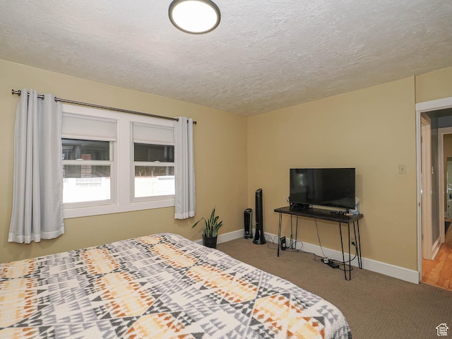 1527 E Princeton Ave S, Salt Lake City, UT 84105 - carpeted bedroom with baseboards and a textured ceiling