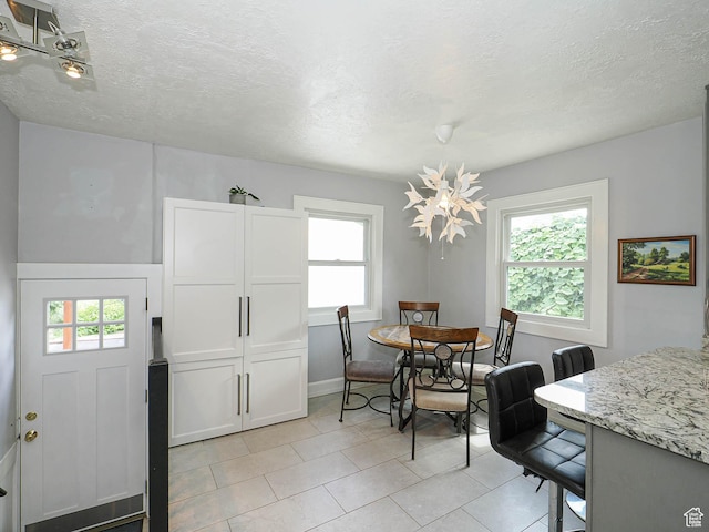 1527 E Princeton Ave S, Salt Lake City, UT 84105 - dining area with a textured ceiling and light tile patterned flooring