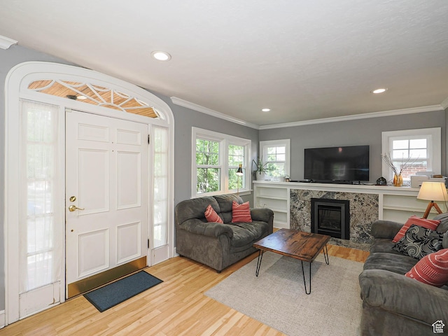 1527 E Princeton Ave S, Salt Lake City, UT 84105 - living room featuring light wood-style floors, ornamental molding, a tile fireplace, and recessed lighting