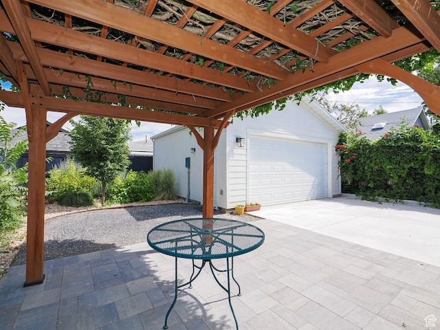 1527 E Princeton Ave S, Salt Lake City, UT 84105 - view of patio / terrace with a pergola, an outbuilding, an attached garage, and concrete driveway
