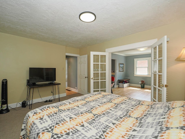 1527 E Princeton Ave S, Salt Lake City, UT 84105 - bedroom featuring french doors and a textured ceiling