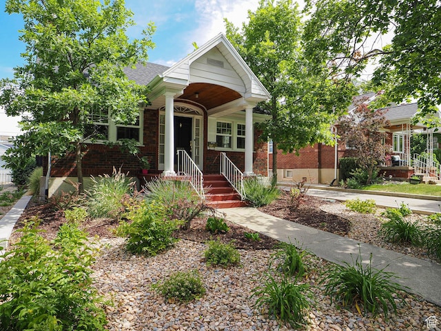 1527 E Princeton Ave S, Salt Lake City, UT 84105 - view of front of home featuring brick siding and roof with shingles