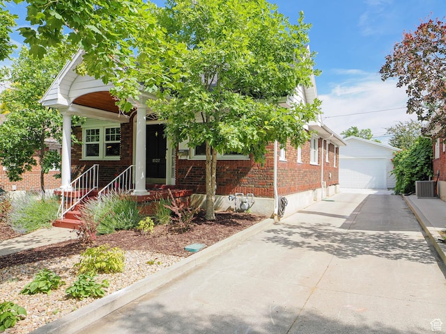 1527 E Princeton Ave S, Salt Lake City, UT 84105 - view of front of home featuring brick siding, an outdoor structure, and a garage