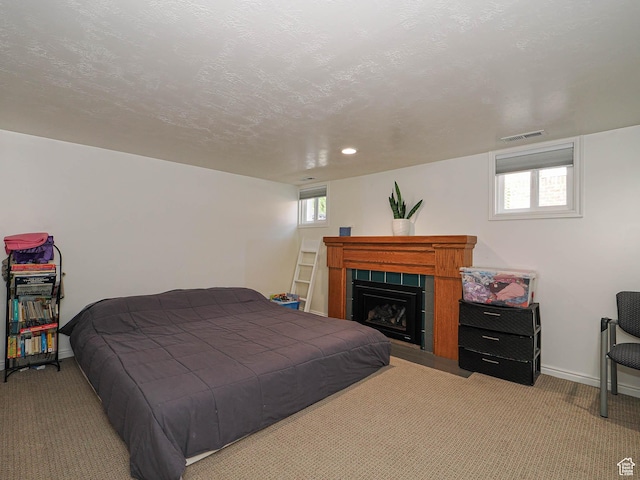 1527 E Princeton Ave S, Salt Lake City, UT 84105 - bedroom with carpet floors, a fireplace, and recessed lighting