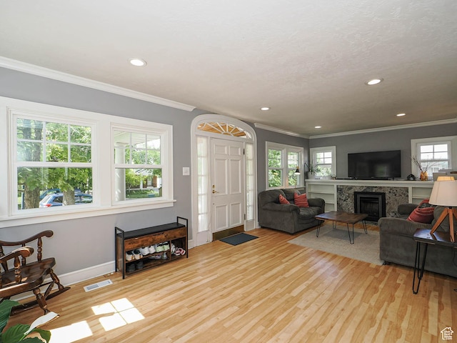 1527 E Princeton Ave S, Salt Lake City, UT 84105 - living area with crown molding, a high end fireplace, light wood-style flooring, and recessed lighting