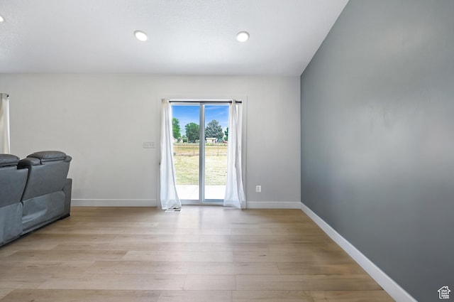 40 S 100 W, Trenton, UT 84338 - unfurnished living room with light wood-style flooring and recessed lighting