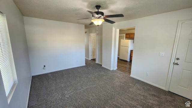 1268 N 800 W, Provo, UT 84604 - unfurnished bedroom with freestanding refrigerator, dark carpet, a textured ceiling, and ceiling fan