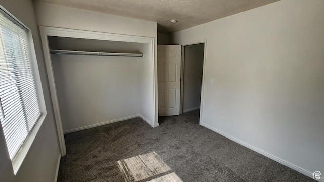 1268 N 800 W, Provo, UT 84604 - unfurnished bedroom featuring multiple windows, carpet floors, a closet, and a textured ceiling
